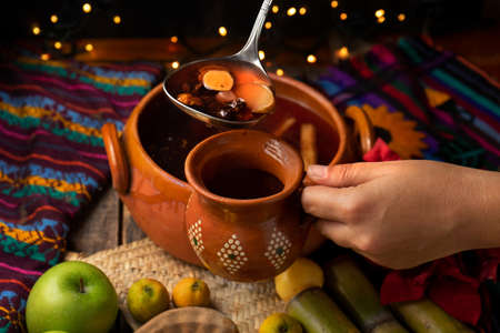 Traditional christmas fruit punch on a wooden backgroundの写真素材