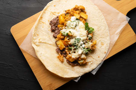 Picadillo burrito with beans and cheese. Traditional Mexican foodの写真素材