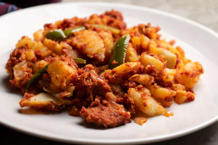 Potatoes with chorizo on a gray background. Traditional Mexican foodの写真素材