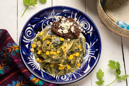 Poblano pepper slices with cream sauce. traditional mexican foodの写真素材