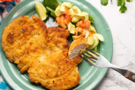 Crispy chicken breast fillets with salad. Healthy food