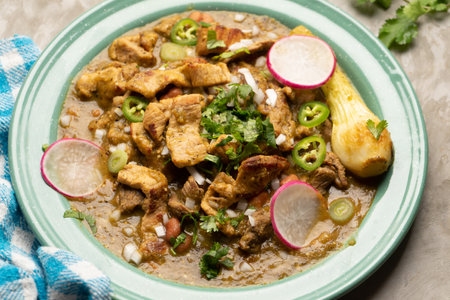 Meat in its juice is a stew with green sauce and steak. traditional mexican foodの写真素材