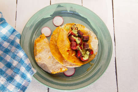 Chistorra quesadillas with green sauce. traditional mexican foodの写真素材