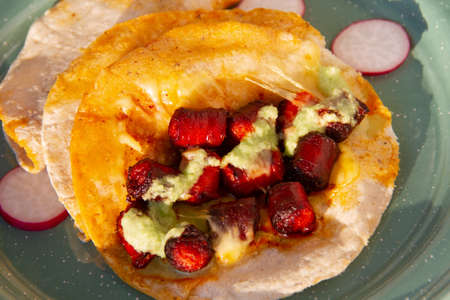 Chistorra quesadillas with green sauce. traditional mexican foodの写真素材