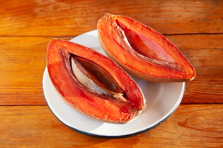 Traditional mexican fruit called mamey on wooden backgroundの写真素材