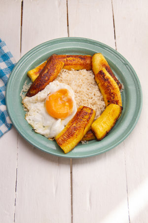 iconic Cuban dish with rice, fried plantain, and eggs.の写真素材
