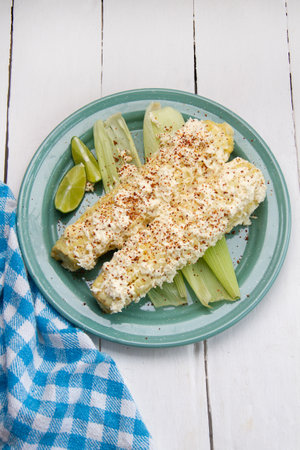Mexican street food; Elotes with mayonnaise, cheese and chili powderの写真素材