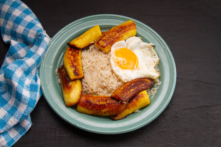iconic Cuban dish with rice, fried plantain, and eggs.の写真素材