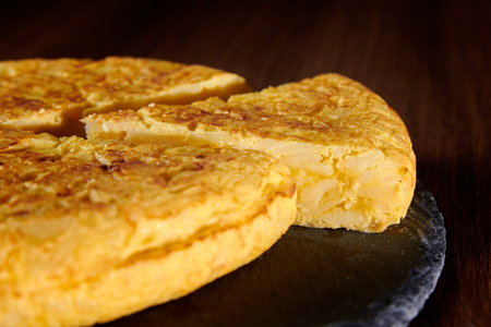 A closeup of a fresh tasty Spanish omelette, a traditional dish from Spainの写真素材