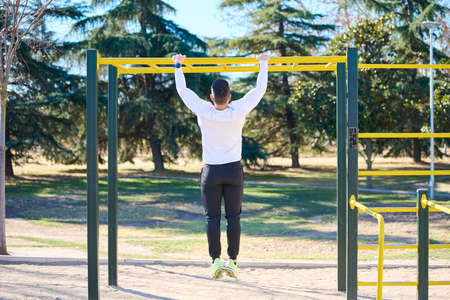 young boy exercising in a park