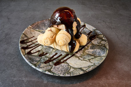 Delicious cookies with chocolate syrup on a marble plate. High quality photos