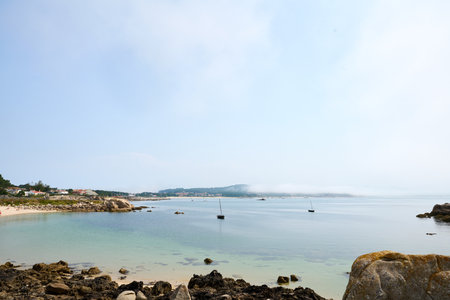 Tropical beach with rocks and blue sky. Nature background.の写真素材