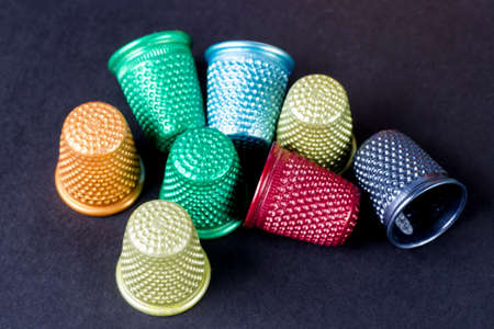 Dolored Thimbles Isolated on Black Textureの写真素材