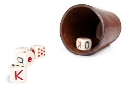 Old Beaker With Dices Isolated on Whiteの写真素材