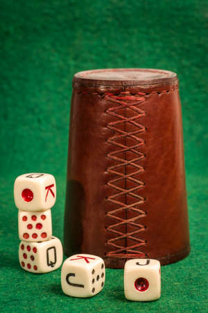 Dice Cup with Dices on Greenの写真素材