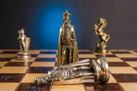 Some Chess Metallic Pieces on Their Board