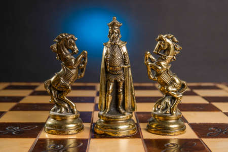 Some Chess Metallic Pieces on Their Boardの写真素材