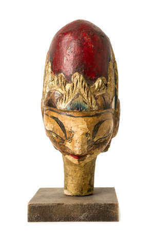 Old Indonesian Wooden Head Isolated on Whiteの写真素材
