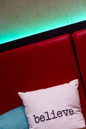 A cushion with believe wordの写真素材