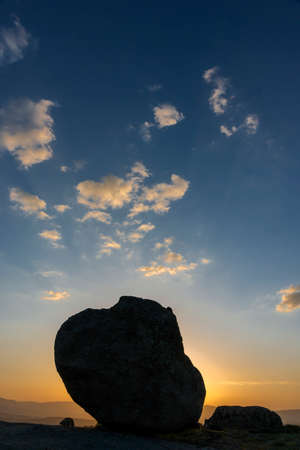 Rock at Sunset. wiht Blue Sky and Clouds.の写真素材