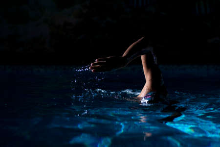 Had of Swimmer Crol Style at Night.の写真素材