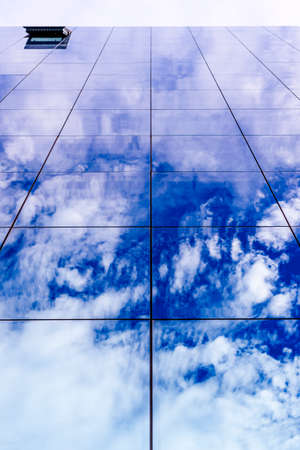 Modern building facade with reflections and colours.の写真素材
