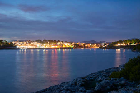 Village of Porto petro, Majorca, Balearic Islands, Spain, Europe,at night as seen from a sailboat in the Marinaの写真素材