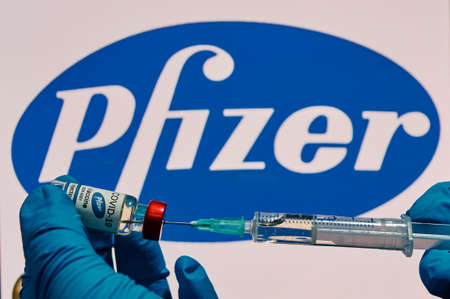 MALLORCA / SPAIN- November 17 2020: Pfizer Biontech research Coronavirus (Covid 19) vaccine. Row of vaccine bottles with blurred Pfizer company logo on background.のeditorial素材