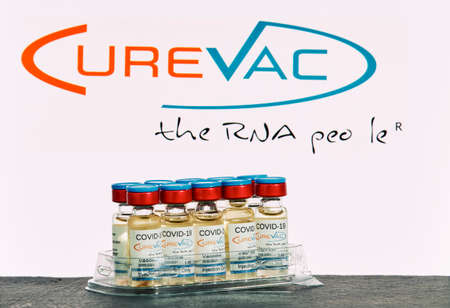 MALLORCA / SPAIN- November 21 2020: CureVac research Coronavirus (Covid 19) vaccine. Row of vaccine bottles with blurred CureVac company logo on background.のeditorial素材