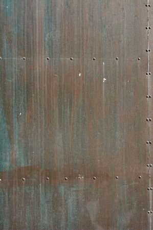 iron door texture, rust, with red, blue, brown colors, plates glued with rivets