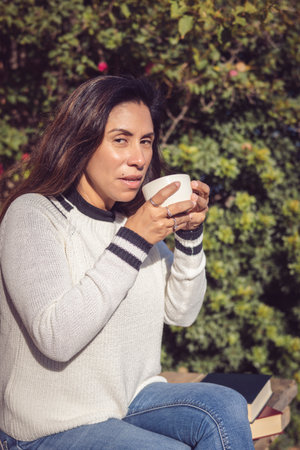Latina Woman Enjoying Nature in the Gardenの写真素材