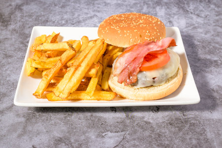 hamburger plate with egg,bacon and french friesの写真素材