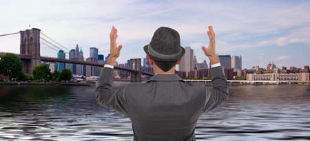 Businessman standing looking at New York City's skylineの写真素材
