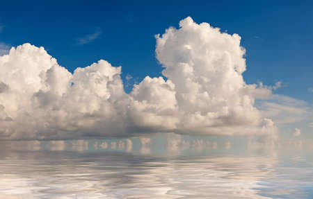 Cloud formation reflected in the oceanの写真素材