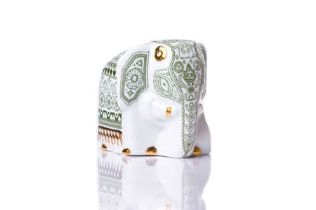 Beautiful porcelain elephant isolated with reflectionの写真素材