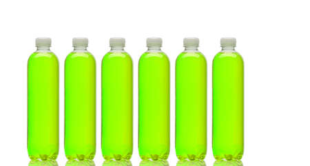 Row of bottles with green beverageの写真素材