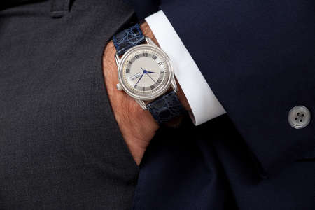 Close up of a man's hand wearing a watch