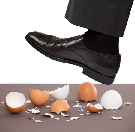 Man walking on egg shellsの写真素材