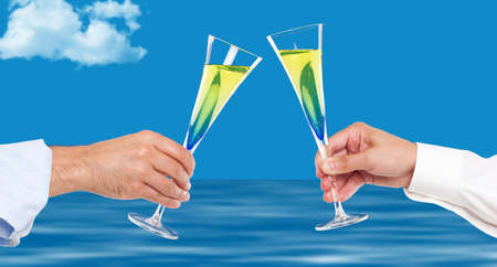 Two men hands toasting with champagneの写真素材