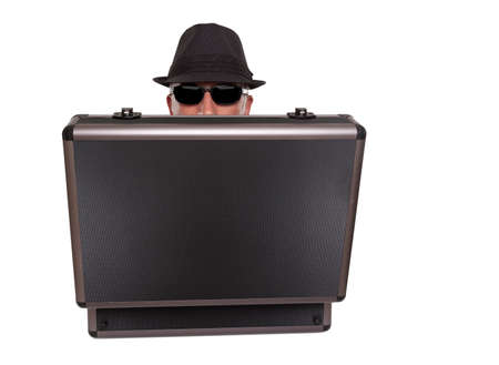 Man hiding behind a caseの写真素材