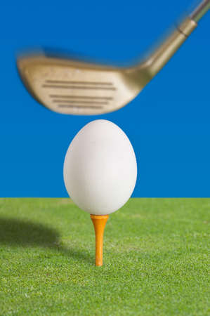 Egg on a golf teeの写真素材