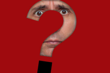 Face behind a question mark paper cut outの写真素材