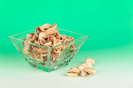 Beautiful crystal bowl with pistachio shellsの写真素材