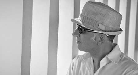 A thoughtful looking man next to concrete pillarsの写真素材