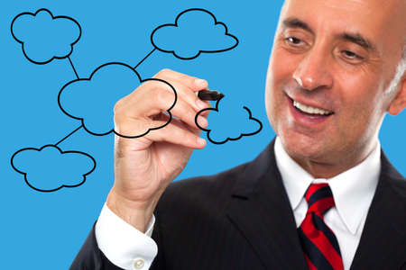 Man draws a diagram for cloud computingの写真素材