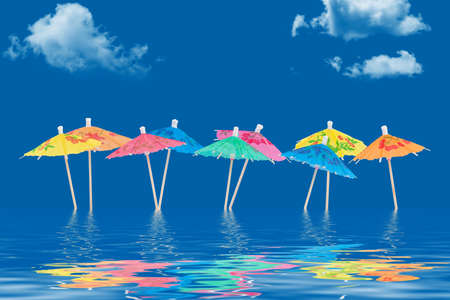 Paper umbrellas standing in waterの写真素材