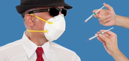 Man wearing a mask being vaccinatedの写真素材