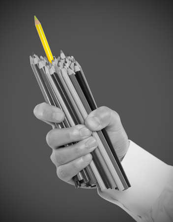 Hand holding pencilsの写真素材