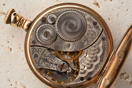 Gears and mainspring in the mechanism of a pocket watch
