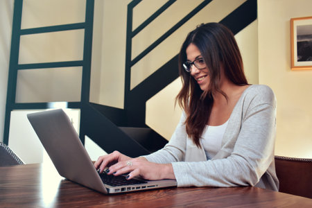 Young woman working at home with laptopの写真素材